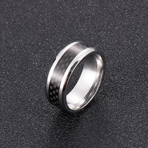 Macro view of 8mm stainless steel ring with black carbon fiber inlay and silver edges