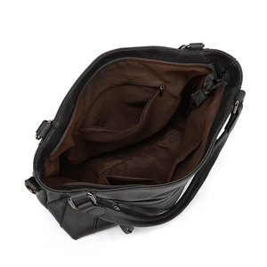 Interior view of black hobo bag showing brown lining with zipper pocket and compartments