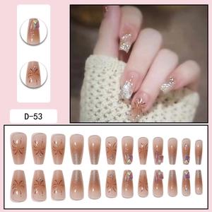 Luxurious champagne gradient press-on nails with fireworks patterns and rhinestones