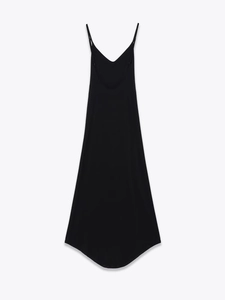 Detail of a slim-fit black crepe maxi dress featuring thin straps and a deep V-neckline