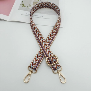 Adjustable canvas shoulder strap with ethnic geometric pattern and gold metal buckles