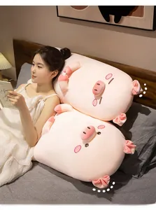 Cute pink plush pig pillow shown in use as a soft bedside cushion for home decor