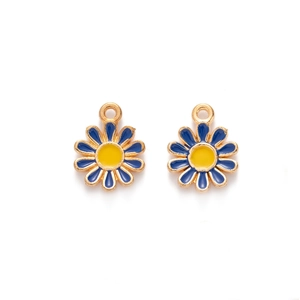 Macro detail of alloy daisy pendants with deep blue enamel and golden metal rings