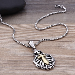 Detailed view of bicolor sword cross pendant on a stainless steel box chain