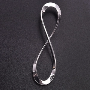 Macro shot of polished silver 304 stainless steel infinity symbol charm with smooth surface