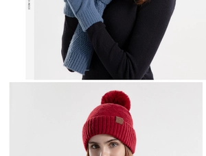 Detail of red knitted beanie with faux fur pompom and blue scarf in diamond weave