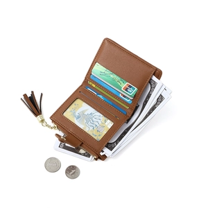 Detail view of brown leather wallet interior showing card slots and zipper coin pocket