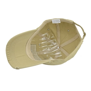 Detail view of khaki cotton baseball cap with distressed brim and US flag lining
