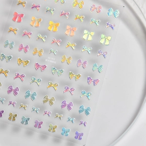 Iridescent aurora bow nail stickers in colorful macaron shades for manicure decoration