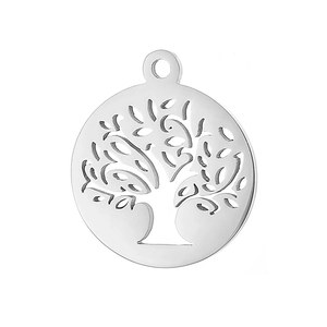 Macro shot of silver titanium steel circular hollow tree of life pendant with hanging loop