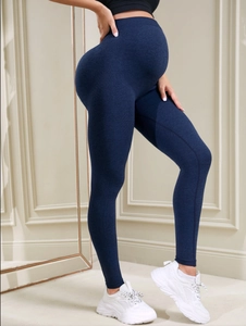 Detailed side view of high-waisted maternity yoga pants with belly support design