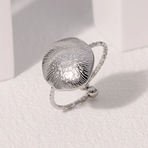 Minimalist silver geometric round ring with sunburst texture and adjustable open band