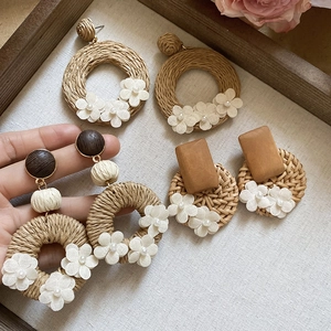 Handmade bohemian style rattan and wooden earrings with fabric flowers and pearls