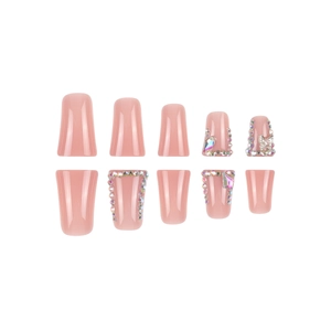 Pink press-on nails with plaid patterns, rhinestones, and decorative 3D butterfly charms