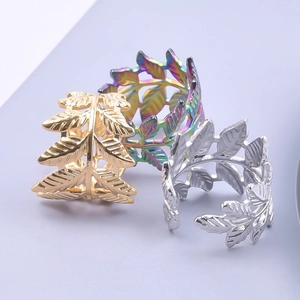 Adjustable leaf rings in gold, silver and rainbow stainless steel with veined texture