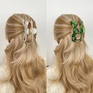 Large acetate bow claw clip for women in pearlescent white and marble green styles