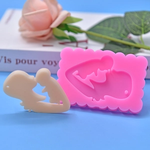 Pink silicone mold with mother and child silhouette design for DIY cake and chocolate