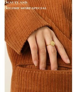 Detailed view of an 18k gold-plated ring with a traditional Chinese Fu character