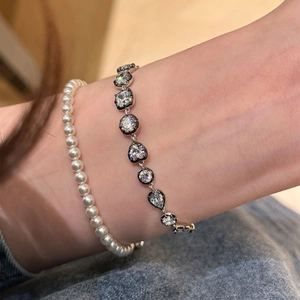 Luxury zircon bead bracelet set with heart and teardrop shapes on model wrist