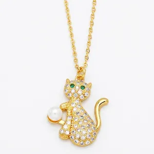 Minimalist gold cat pendant necklace with pavé zircon stones and a round pearl charm