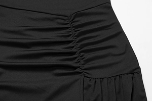 Macro shot of stylish black ruched fabric detailing on a long sleeve autumn dress