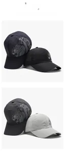 Macro detail of breathable mesh fabric and silver dragon pattern on baseball cap