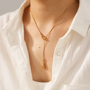 18k gold plated stainless steel Y-shaped necklace with water drop pendant on a model
