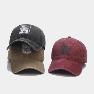 Distressed cotton baseball caps with Mr. Steal Your Heart print in black, khaki, and burgundy