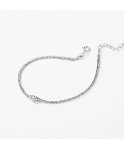 Detailed view of double-layer silver box chain with a round zircon stone and extender