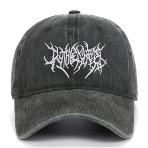 Close-up of gothic embroidery on washed charcoal grey cotton baseball cap with vintage texture