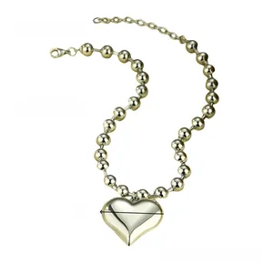 Polished gold heart pendant on ball chain with 4cm width and 52cm total length details