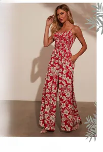 Close-up of smocked bodice and white floral print on red high-waist vacation jumpsuit