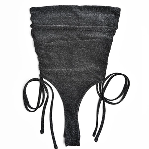 Detailed view of the black sparkling fabric with stylish side drawstrings and ruched texture