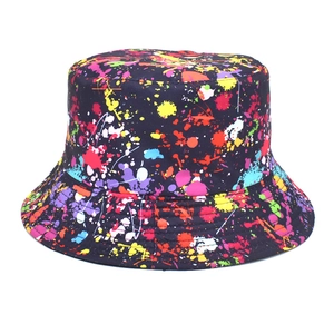 Detailed view of colorful graffiti splash pattern on durable black canvas bucket hat fabric