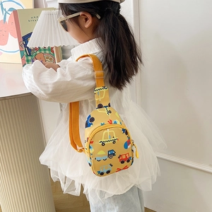 Close-up of cute yellow kids chest bag with cartoon car prints worn by a child