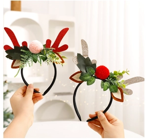 Close-up of DIY reindeer antler headbands with sequins and plush balls for Christmas decor