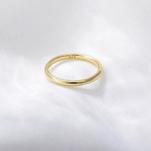 Macro shot of 14K gold plated sterling silver minimalist ring showing 925 hallmark stamp