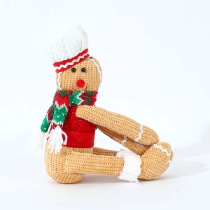 Knitted gingerbread man doll with chef hat and scarf for Christmas home decor