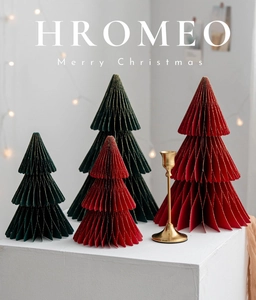 Detail of red and green honeycomb paper Christmas trees with gold glitter edges