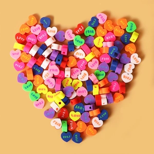 Colorful heart-shaped LOVE beads for DIY jewelry making arranged in a large heart shape
