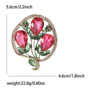 Gold balloon flower brooch with pink rhinestones and green leaves including dimensions