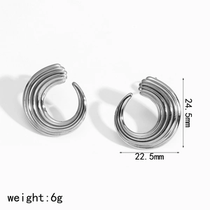 Macro detail of silver C-shaped textured earrings showing 24.5mm height and 6g weight