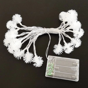 Detail of white LED snowflake lights with battery box and flashing function switch