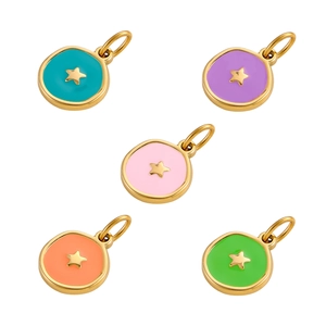 Close-up of five colorful enamel star charms with gold-plated borders in various vibrant hues