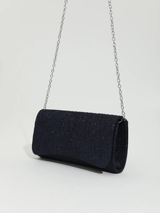 Detail of navy blue glitter envelope clutch bag with elegant silver metal chain strap