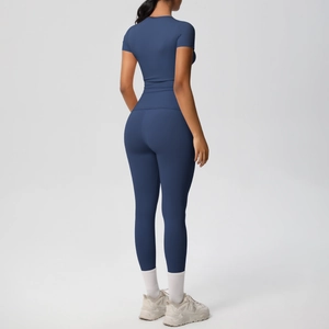 Rear view of sleek navy blue compression yoga set showing high waist and snug fit