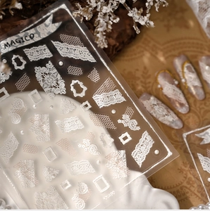Detail showing white lace nail stickers KX490 with pearls and gold chains for elegant manicure