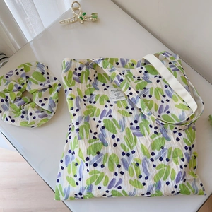 Floral print cotton tote bag and matching scrunchie set with green leaf patterns