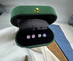 Classic 6mm pink and white round zircon stud earrings in a green velvet jewelry box