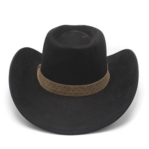 Detailed close-up of a black wool felt cowboy hat with a brown polka dot decorative band